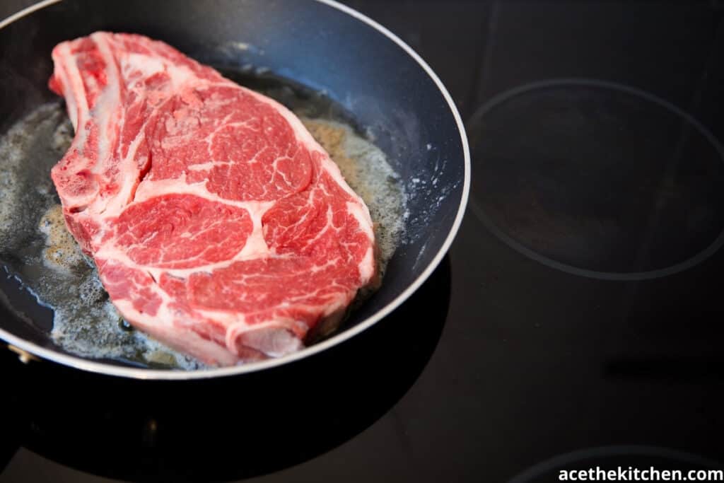 steak in a pan with butter